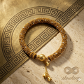 Slowloop | Golden Echo: Hand-Woven Imperial Huiwen Bracelet with Artisanal Dangles