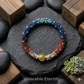 Slowloop | Verdant Veil: The Great Harmony Hand-Woven Bracelet with Spiral Pendant & Pearl Accents